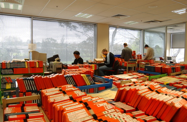 Room filled with trollies of cassette books waiting to be returned