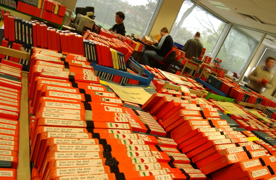 Room filled with trollies of cassette books waiting to be returned