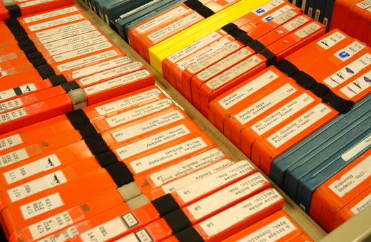 Room filled with trollies of cassette books waiting to be returned