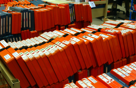 Trollies of cassette books in the Circulation room