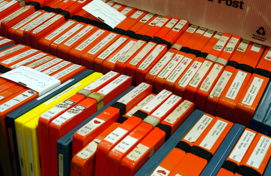 A trolley of cassette books in the Circulation room