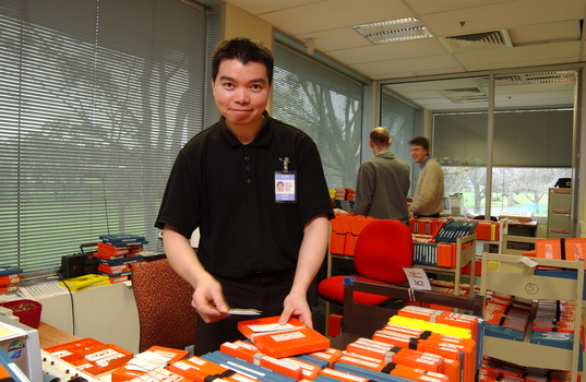 Circulation Assistant Carl Sayo returning cassette books