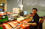 Circulation Assistant Carl Sayo returning cassette books