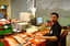 Circulation Assistant Carl Sayo returning cassette books