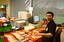 Circulation Assistant Carl Sayo returning cassette books