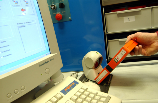 Scanning books into or out of the hanging carousel