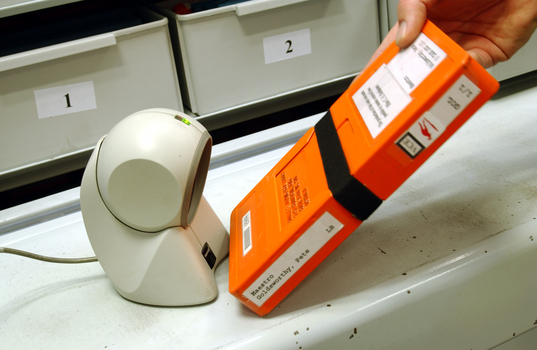 Scanning books into or out of the hanging carousel