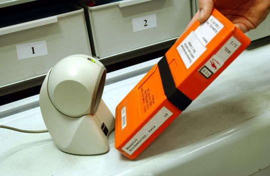 Scanning books into or out of the hanging carousel