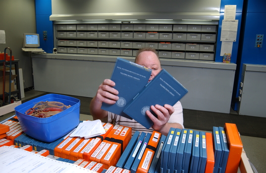 Circulation Assistant Matt carding the books for dispatch