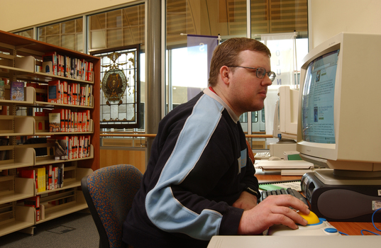 Tim Mitchell using a computer in the Browsing Library