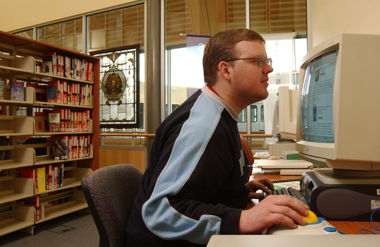 Tim Mitchell using a computer in the Browsing Library