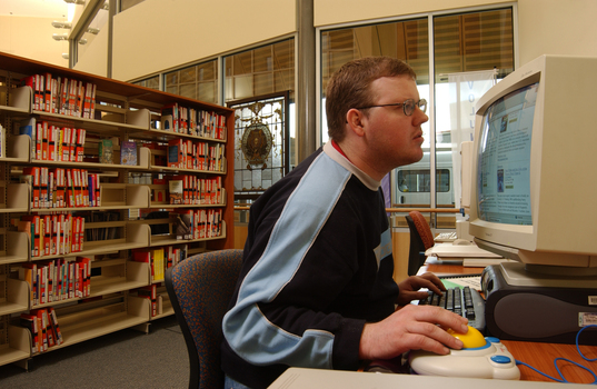 Tim Mitchell using a computer in the Browsing Library