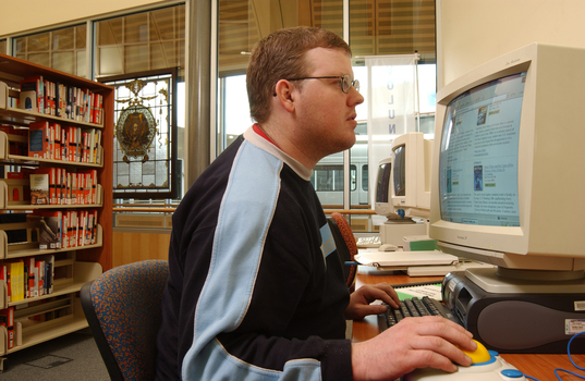 Tim Mitchell using a computer in the Browsing Library