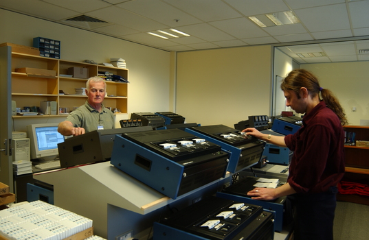 Ted Johnson and Justin Bates operate the machines