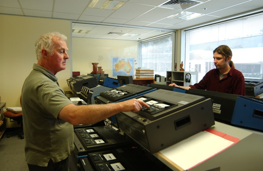 Ted Johnson and Justin Bates operate the machines