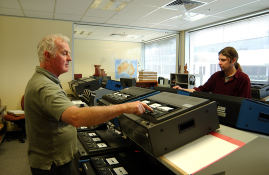 Ted Johnson and Justin Bates operate the machines