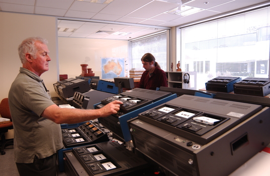 Ted Johnson and Justin Bates operate the machines