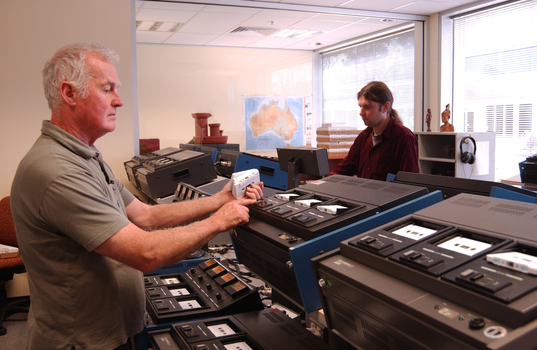 Ted Johnson and Justin Bates operate the machines