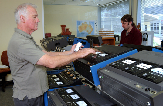 Ted Johnson and Justin Bates operate the machines