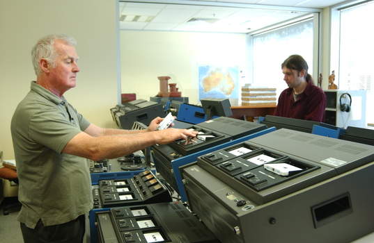 Ted Johnson and Justin Bates operate the machines