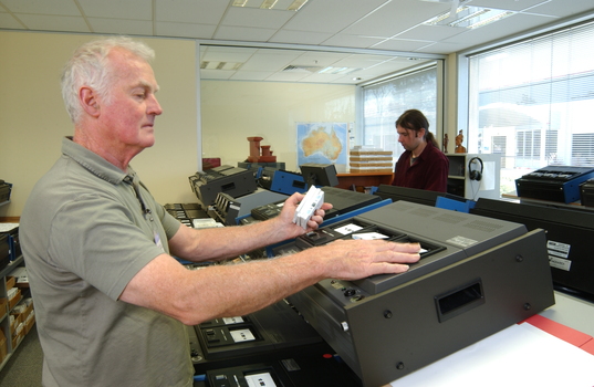 Ted Johnson and Justin Bates operate the machines