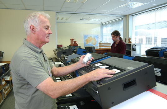 Ted Johnson and Justin Bates operate the machines