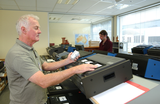 Ted Johnson and Justin Bates operate the machines