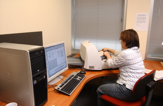 Kelly Thong using a scanner in Transcription