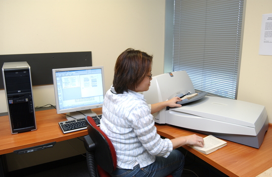 Kelly Thong using a scanner in Transcription