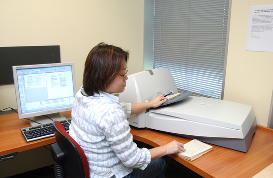 Kelly Thong using a scanner in Transcription