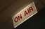 'On Air' sign lit outside studio