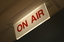 'On Air' sign lit outside studio