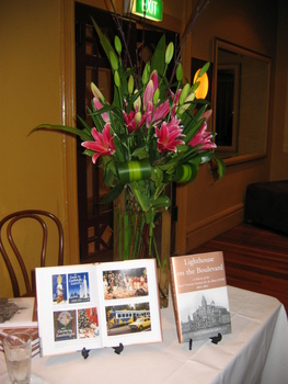 Floral arrangement next to open book