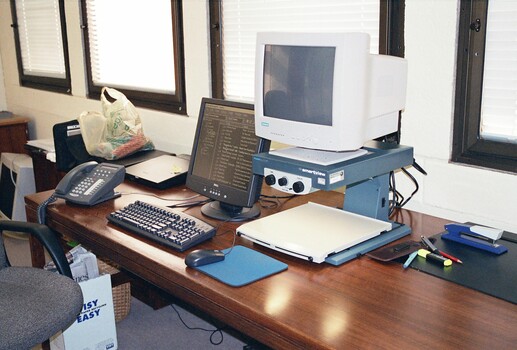 John Landau's desk with his computer and screen magnifier