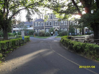 Main driveway with Belgian Beer Cafe table to the left