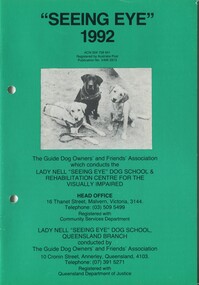 Three dogs in harness with contact details of school