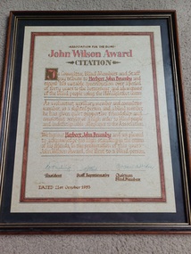 Citation in brown and gold frame