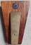Back of award with manufacturer's badge and metal stand