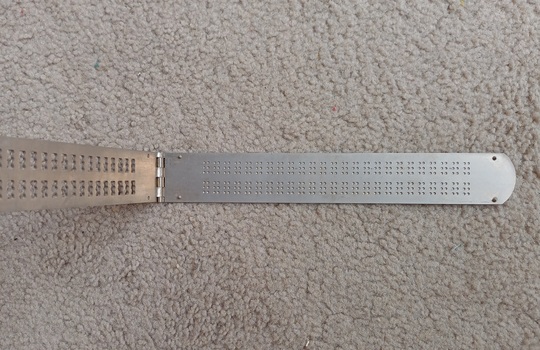 Opened two line Braille frame