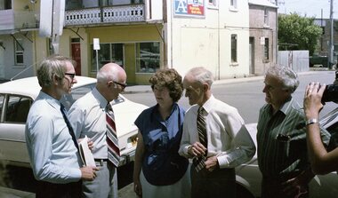 Group of people talking in front of a camera