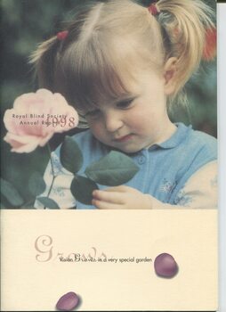 Girl looking at the leaves on a rose bush