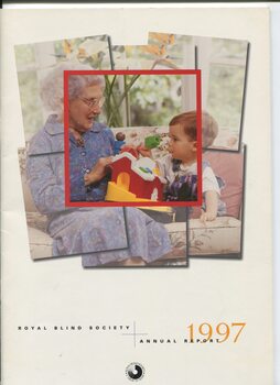 Older female and young boy on a couch with a toy farmhouse