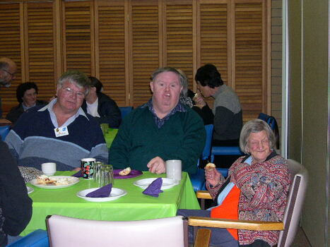 Three people sitting at table from Maryborough