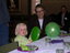 Harriet and Chris sitting at table with green and purple tableware
