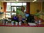 Staff at front counter of equipment shop before branch launch party 