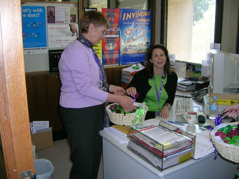 Staff member at her desk on brand launch day