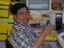 Tony Hernandez at his desk on branch launch day