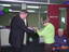 Joan Backwell and Brian Hardy cut the ribbon