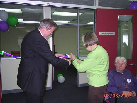 Joan Backwell and Brian Hardy cut the ribbon