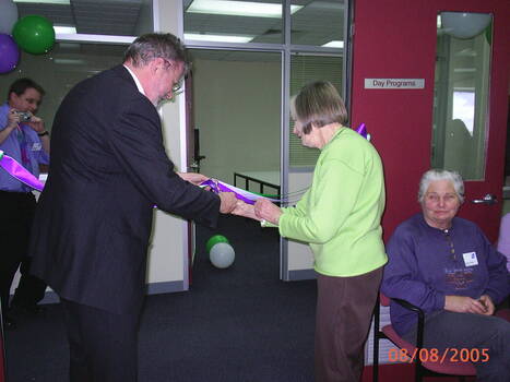 Joan Backwell and Brian Hardy cut the ribbon
